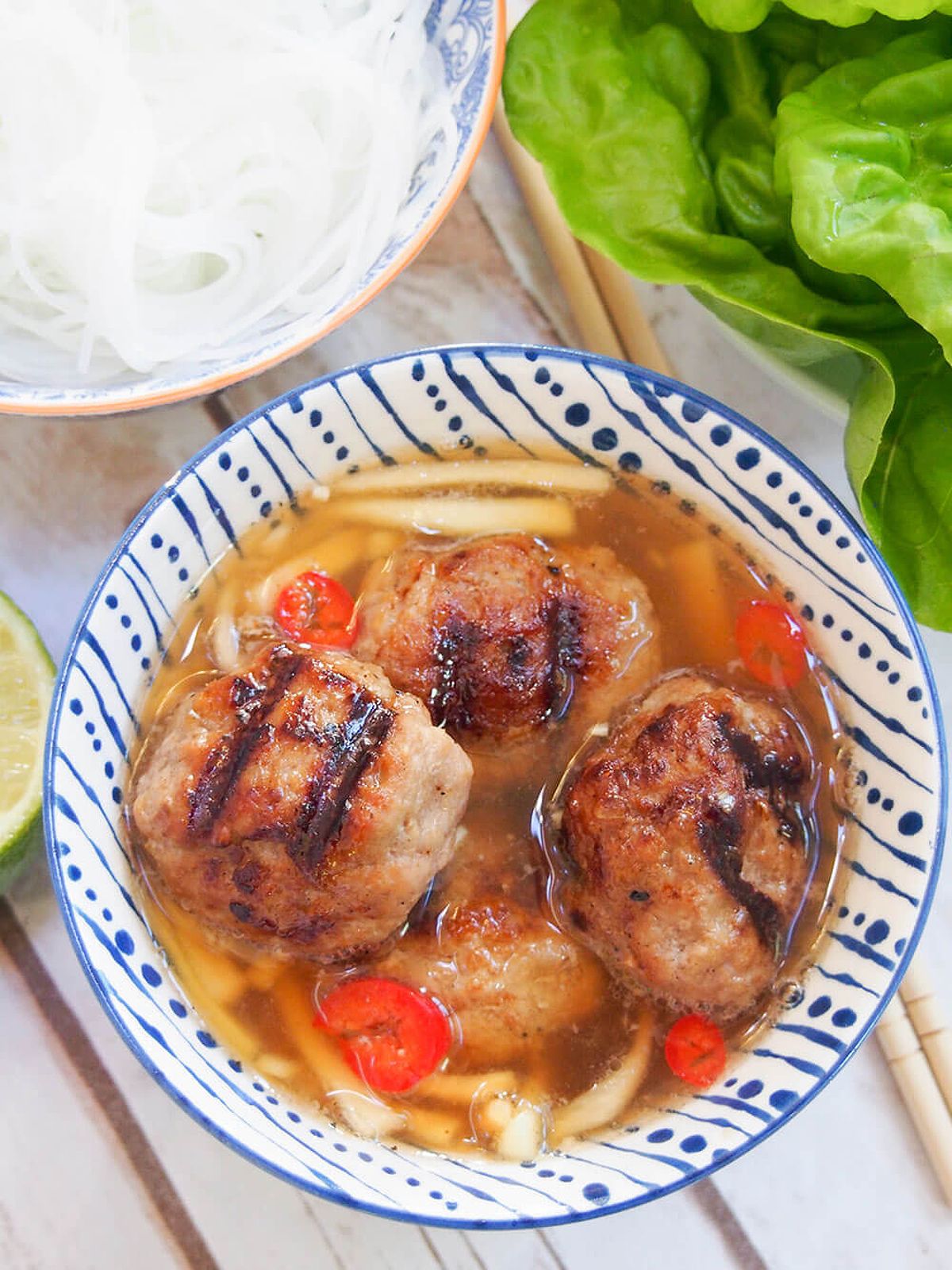 Bun cha Hanoi bowl with meatballs close overhead shot