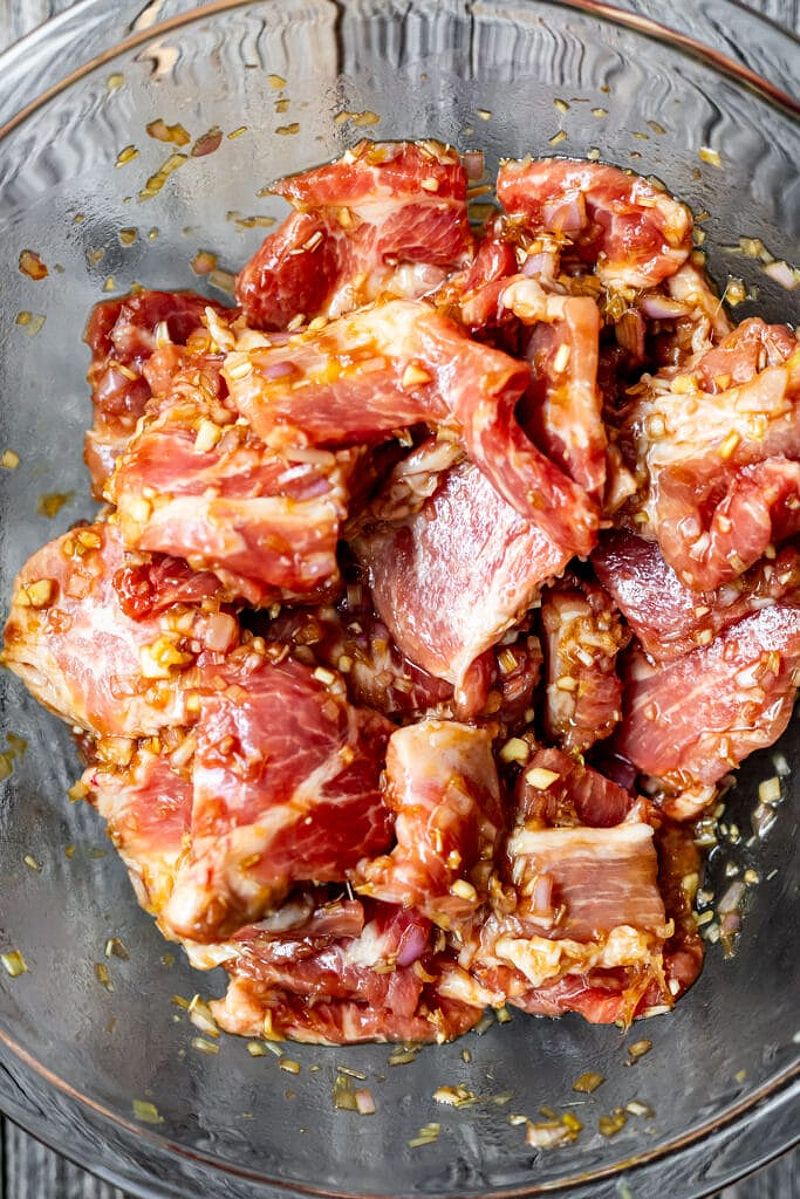 Marinating lemongrass pork in a bowl