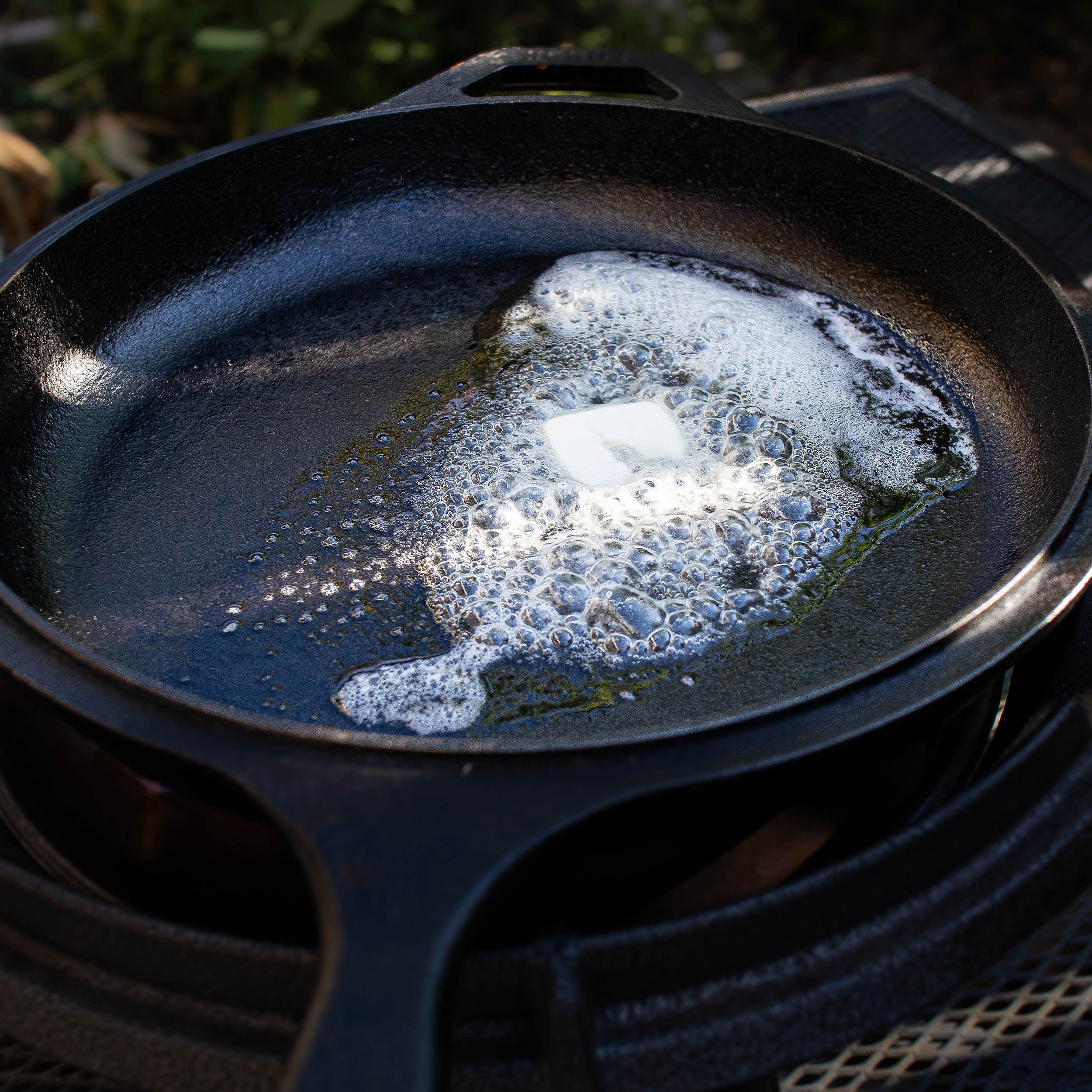 Melt butter on a single-serving cast-iron pan