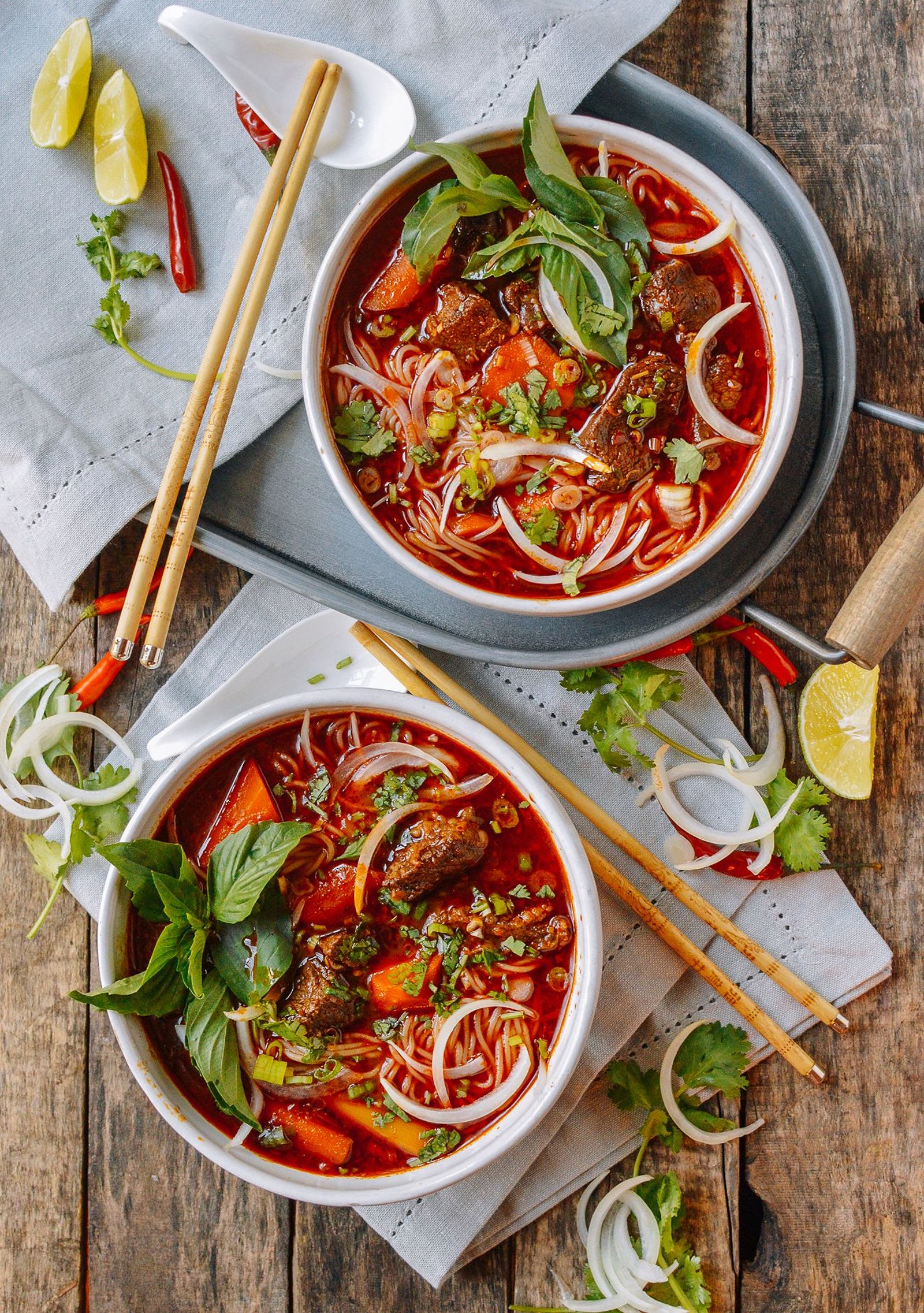 Two bowls of Bo Kho with rice noodles