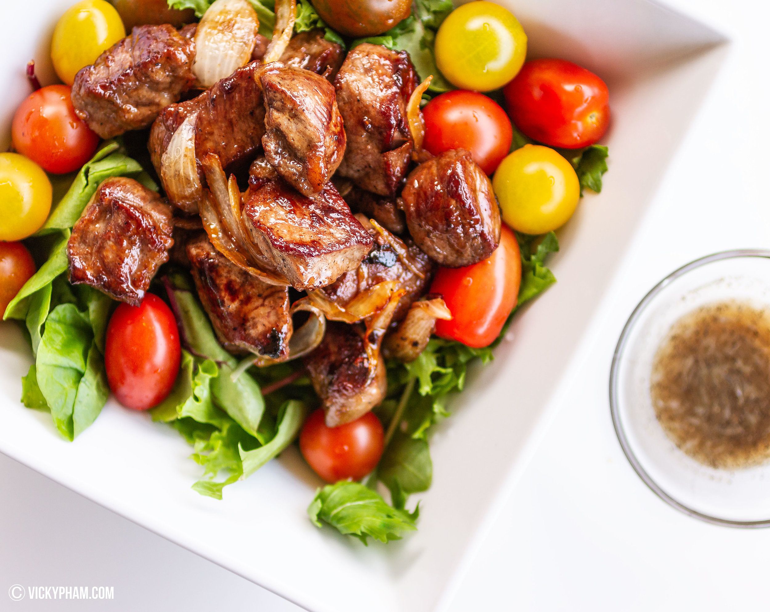 Vietnamese Shaking Beef served with lime-salt-and-pepper dipping sauce