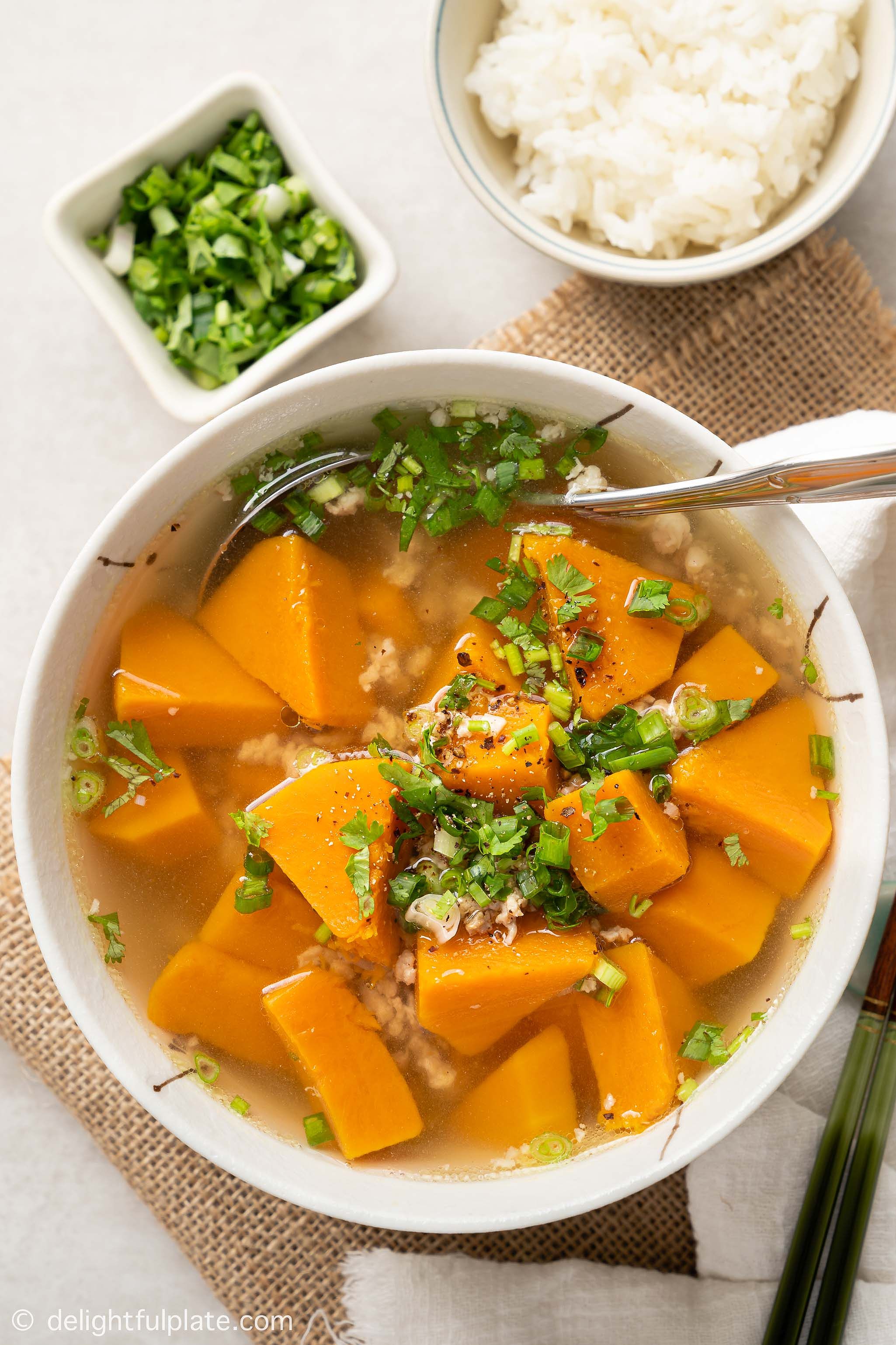 A bowl of Vietnamese pumpkin soup served with rice