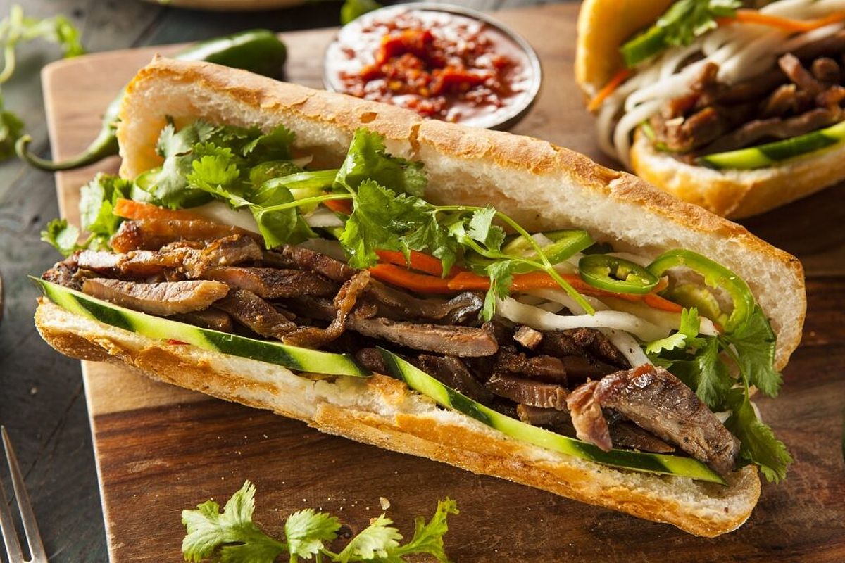 A delicious banh mi sandwich filled with various ingredients