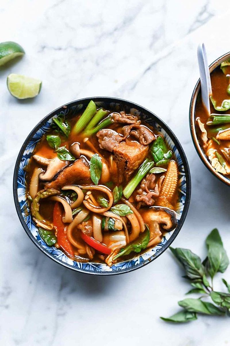 Bowl of Asian hot pot with veggies and beef