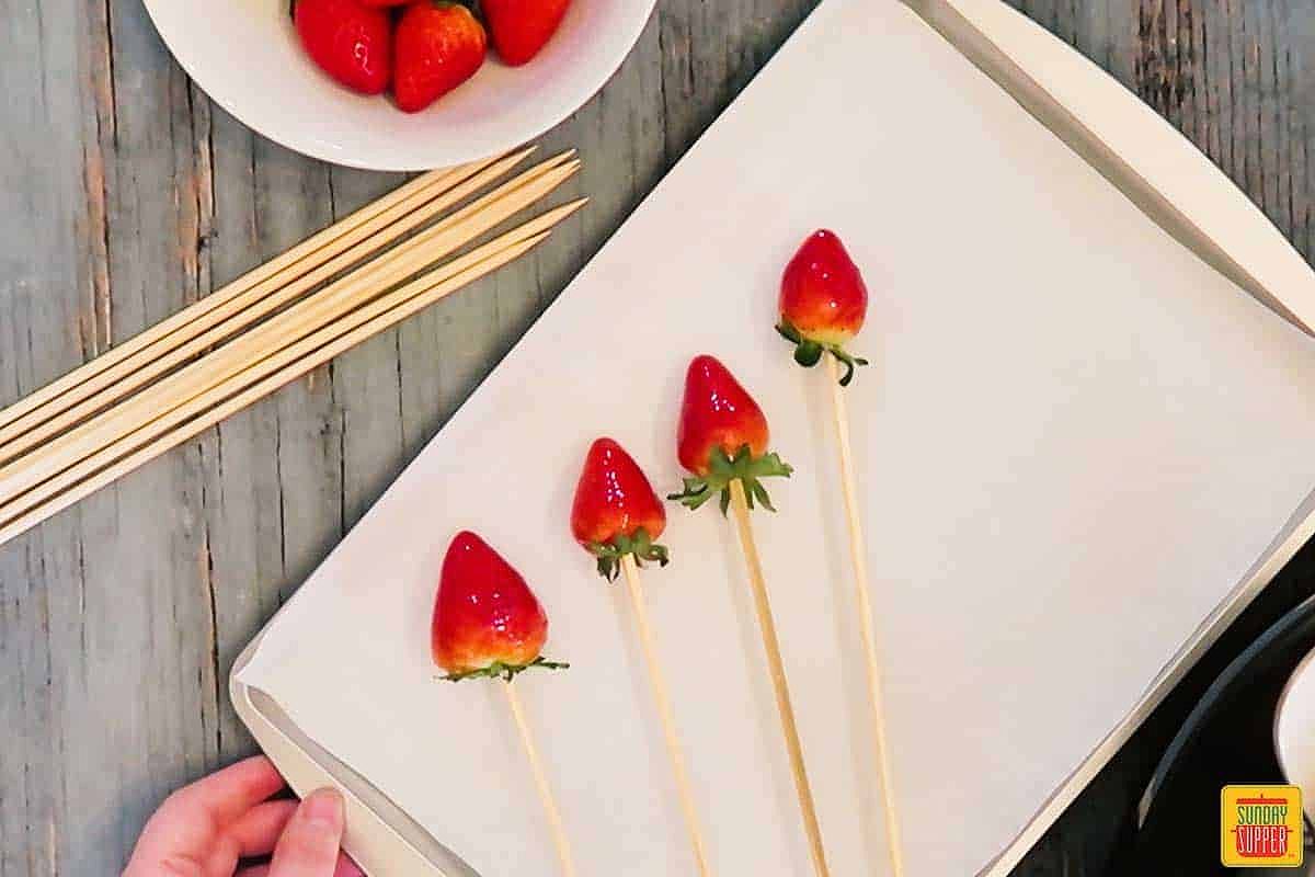 Candied strawberries on skewers