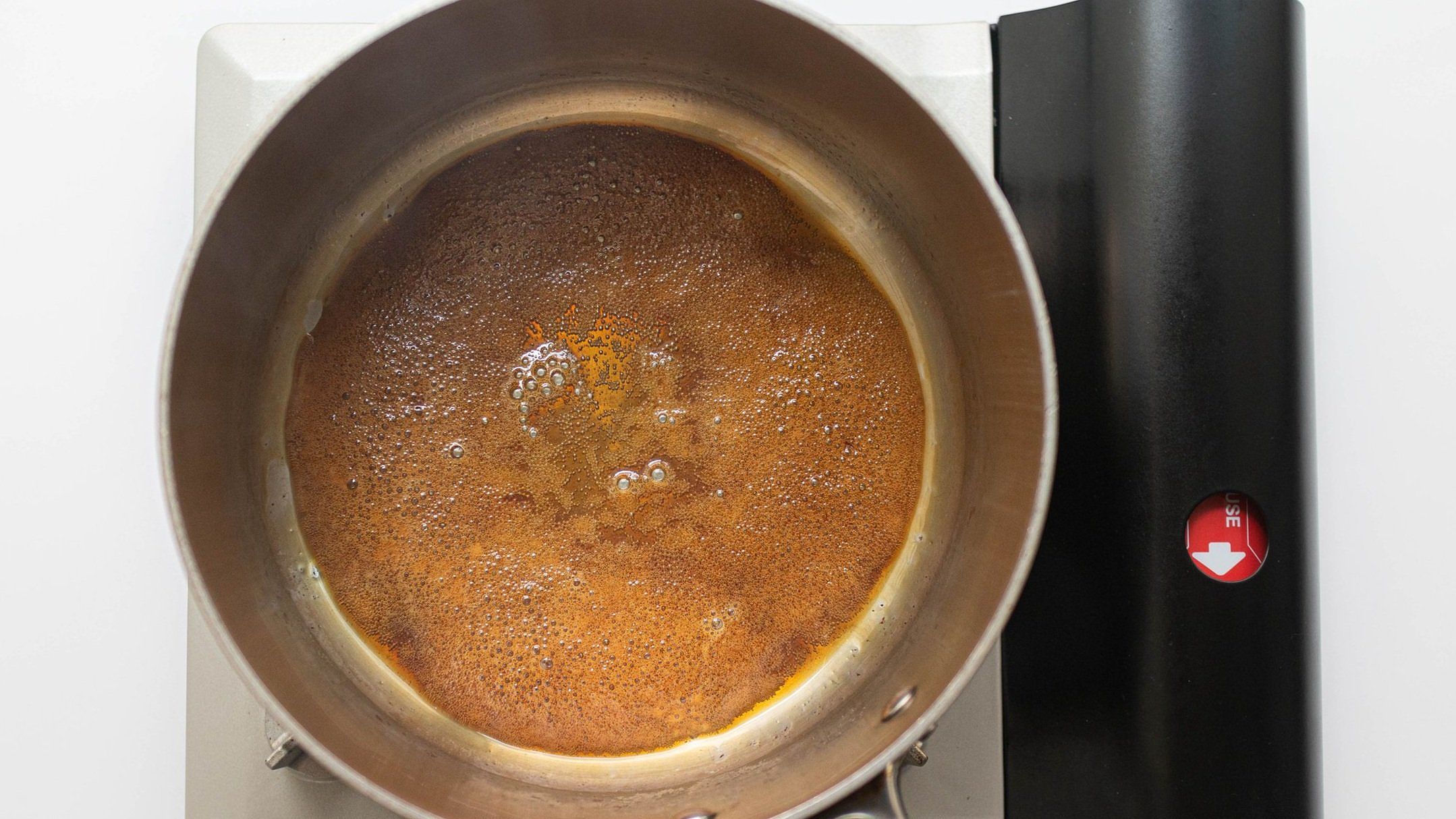 Caramelizing sugar to darken the chicken for Vietnamese Ginger Chicken (Gà Kho Gừng)