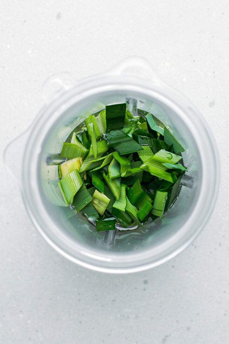 Chopped pandan leaves in a blender