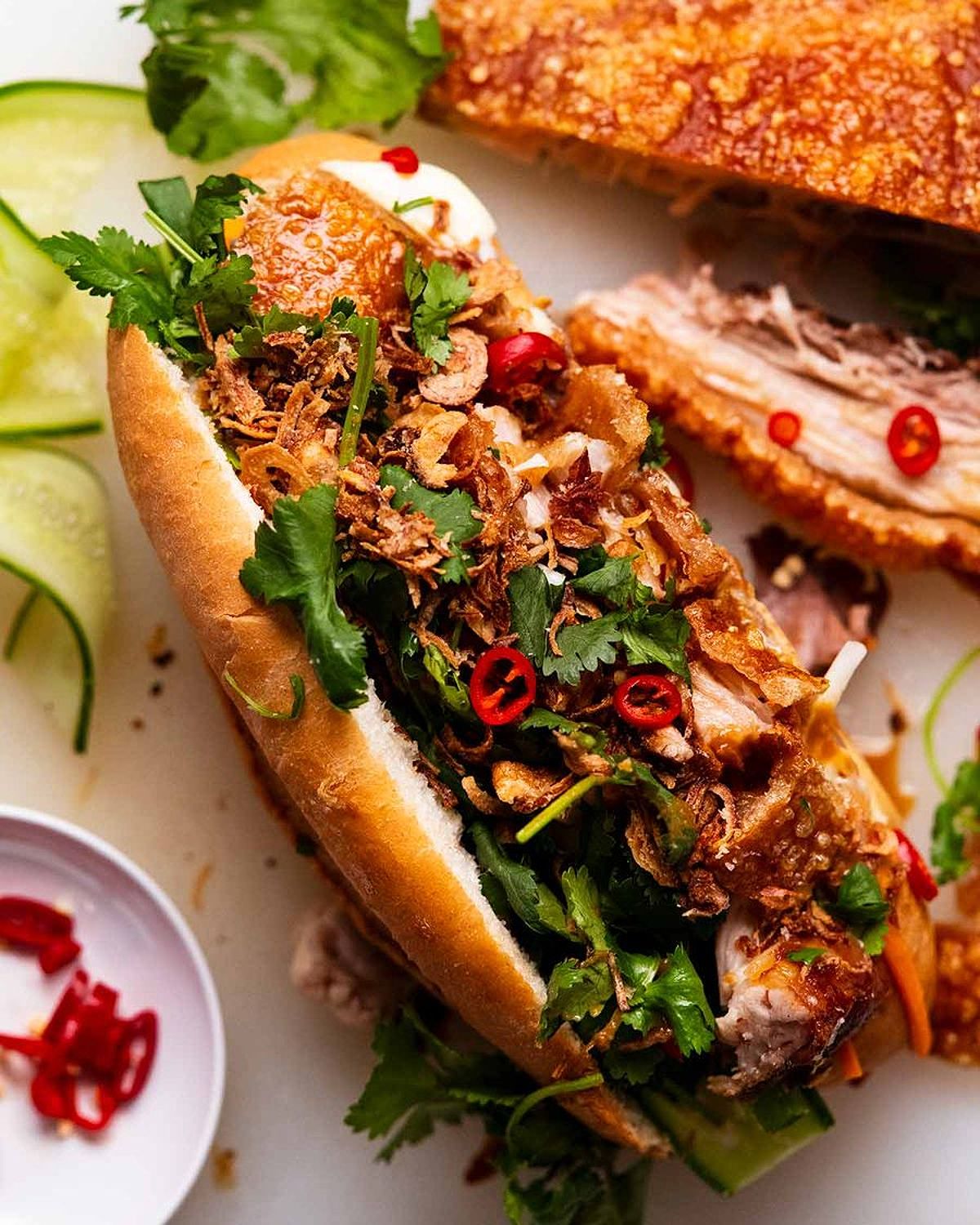 Crispy pork belly banh mi with pickled vegetables