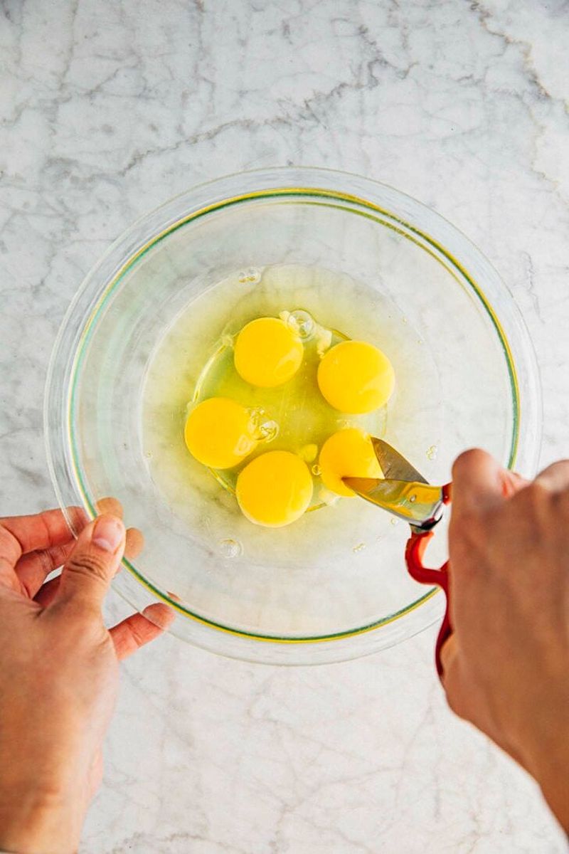 Cutting eggs for the cake batter