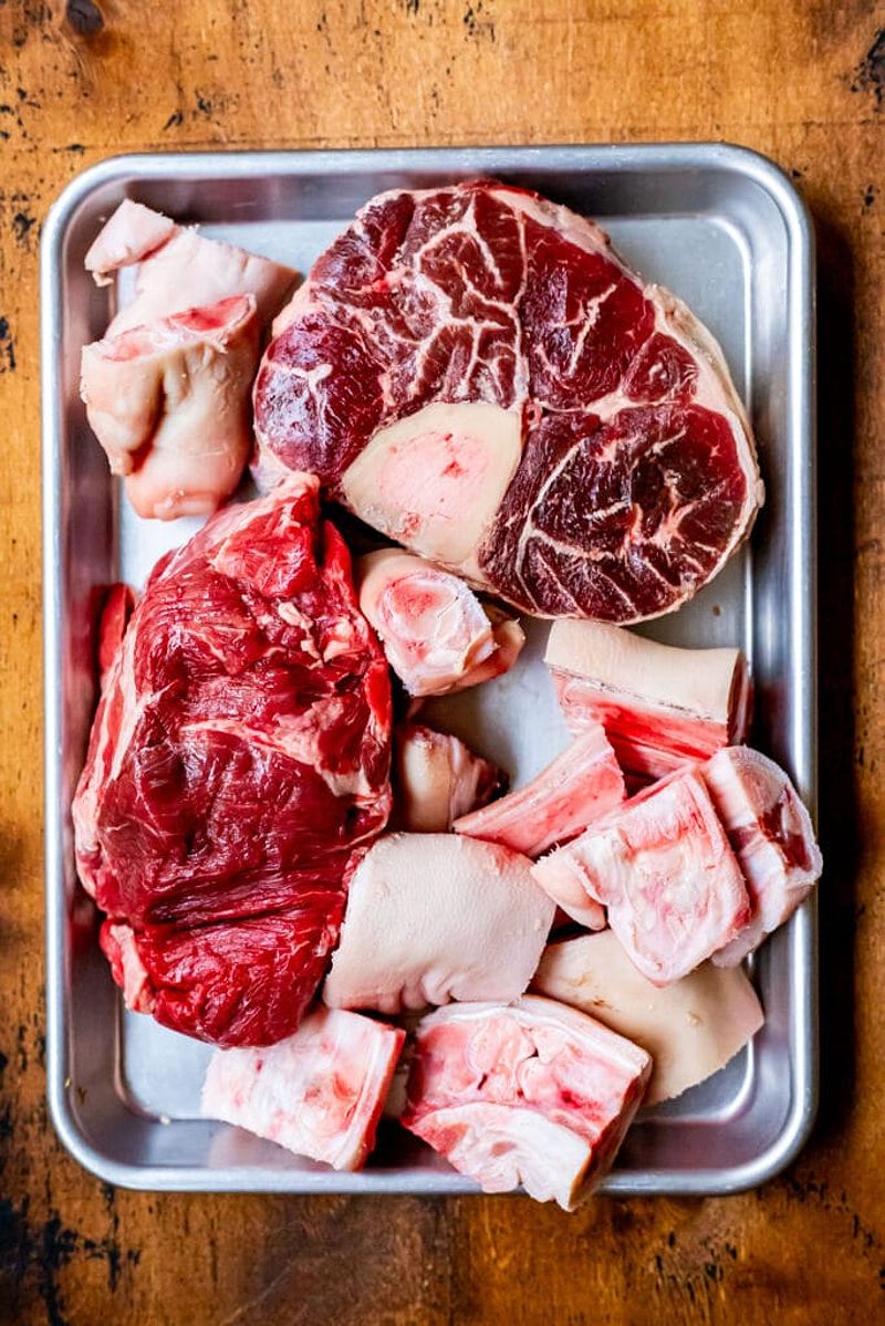 Ingredients for Bun Bo Hue broth including beef and pork