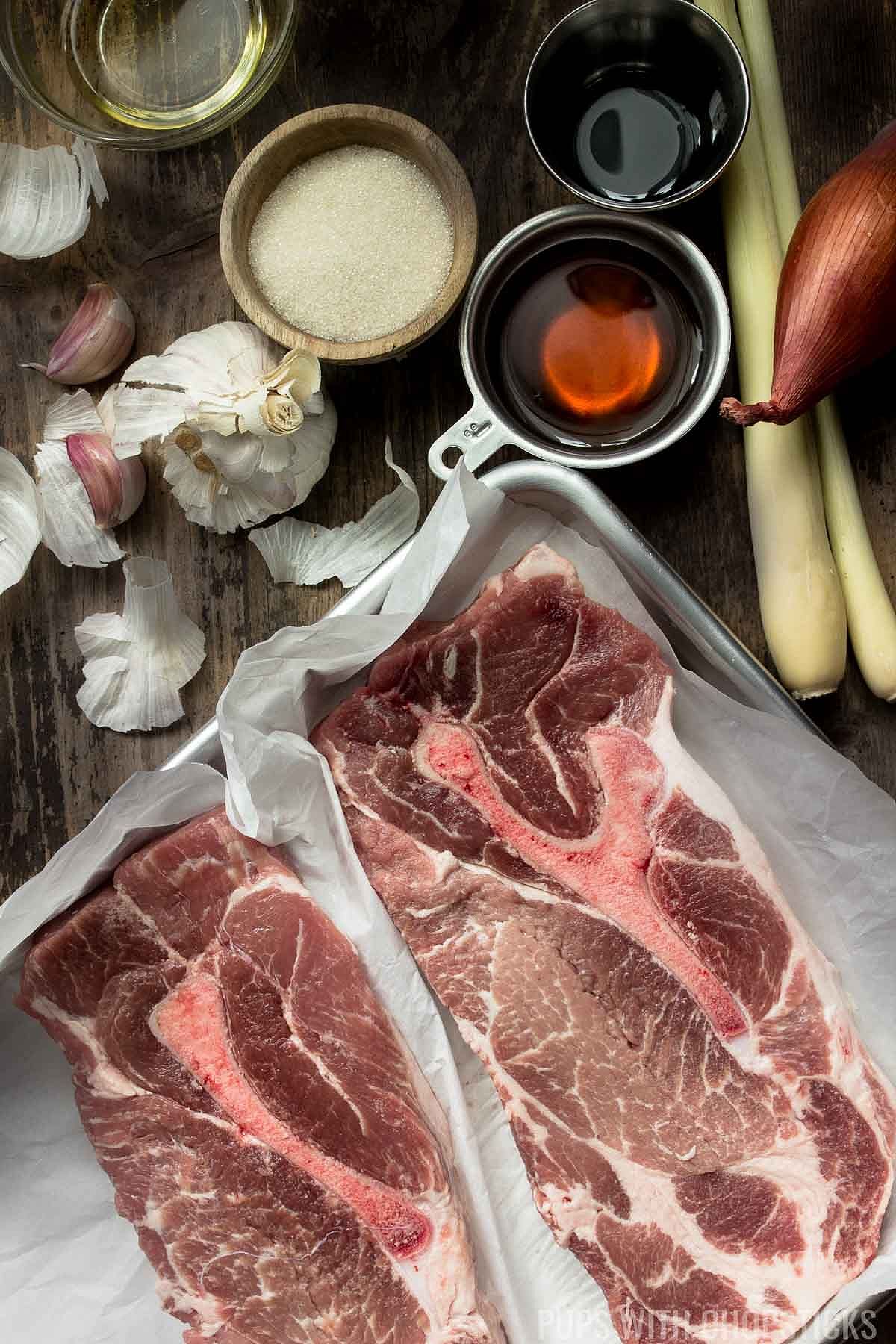 Ingredients for lemongrass pork chops including pork shoulder and seasonings