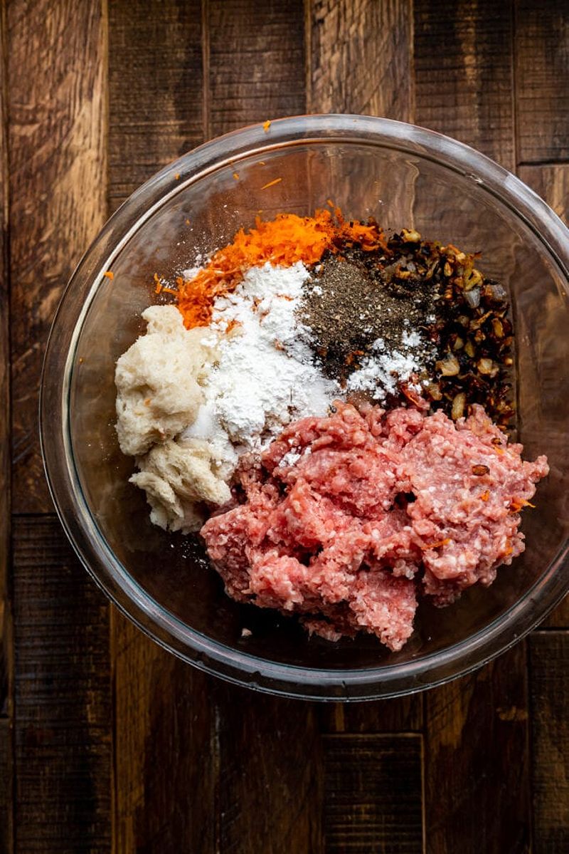 Ingredients for xiu mai in a clear glass bowl