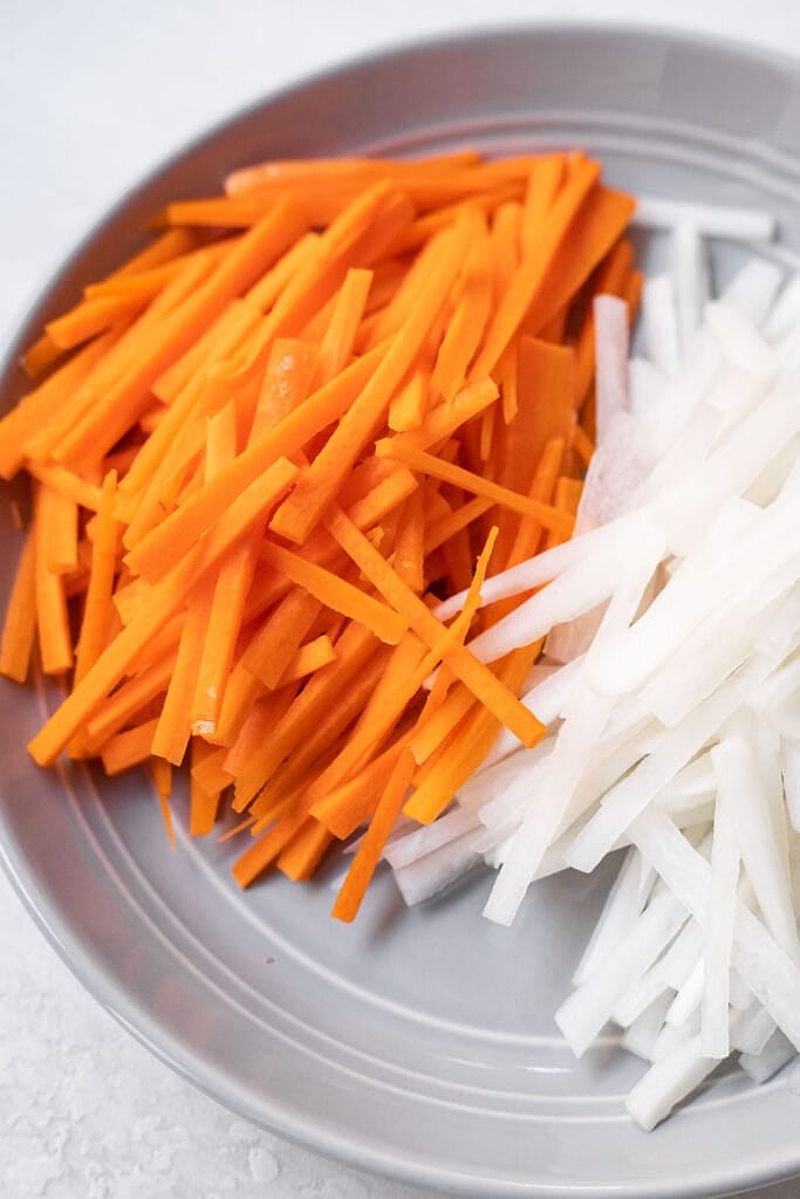 Julienned daikon and carrots prepared for pickling