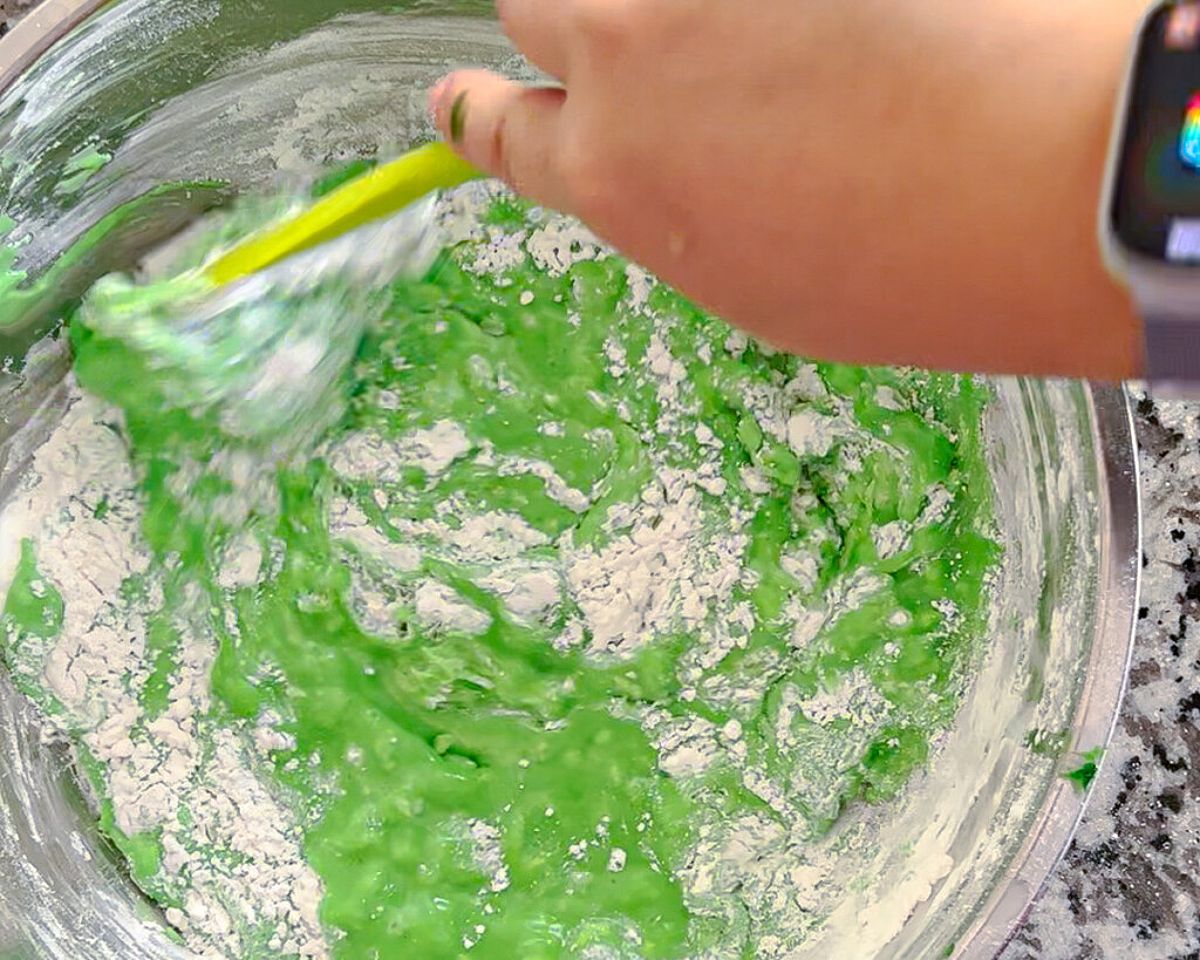 Mixing green batter for pandan waffles