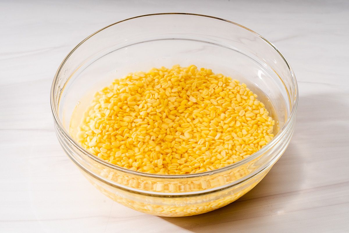 Mung beans soaking in water for banh chung preparation