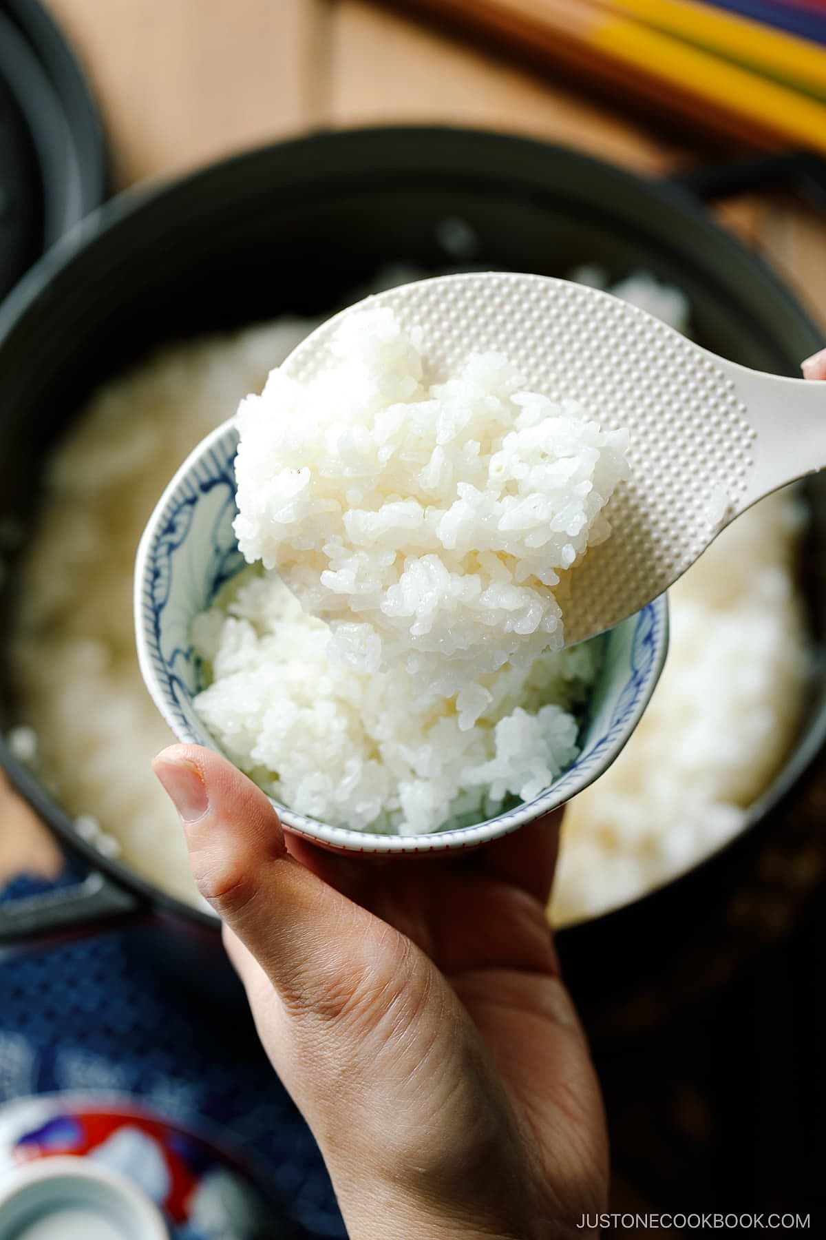 Perfectly cooked Japanese short-grain rice being served in the Japanese rice bowl