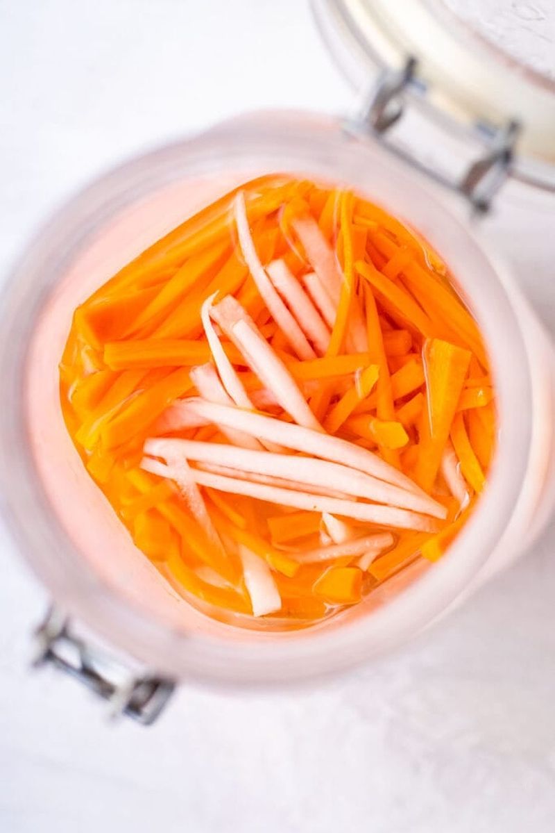 Pickled carrots and daikon in a jar