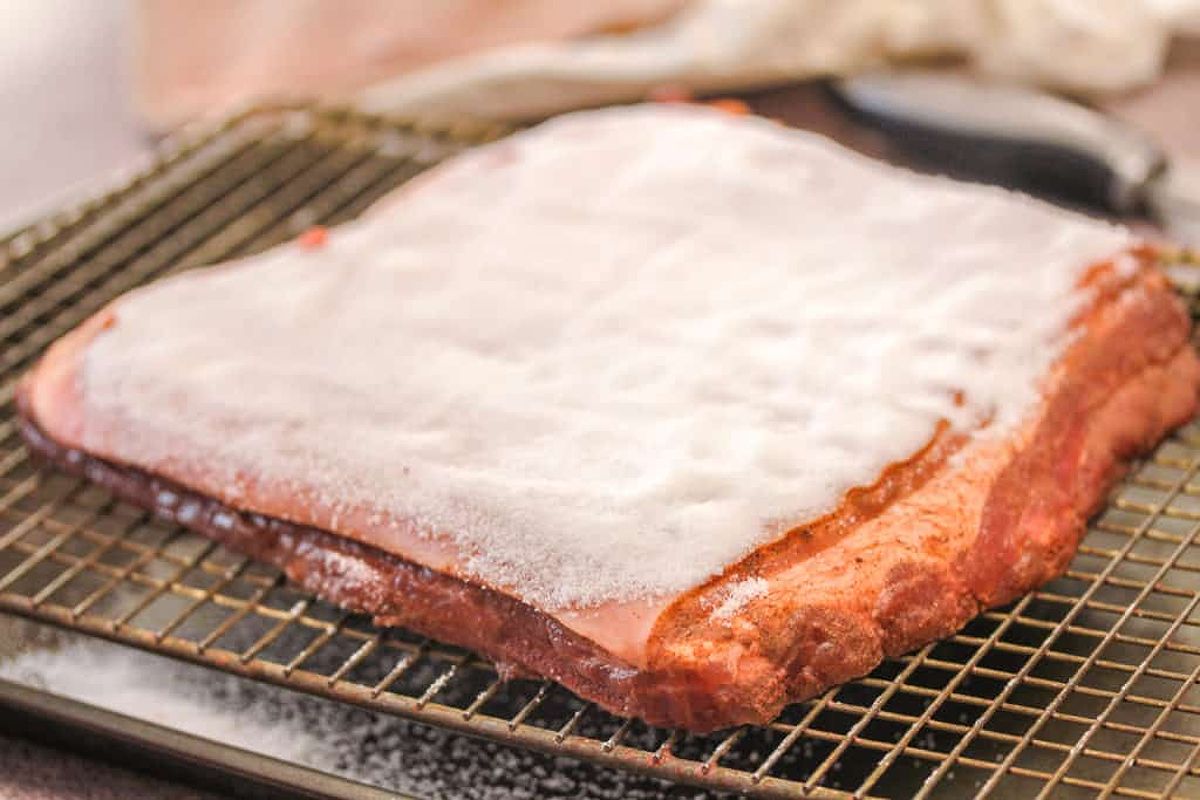 Pork belly covered in salt ready for roasting