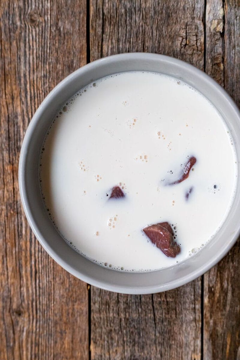 Pork livers soaking in milk