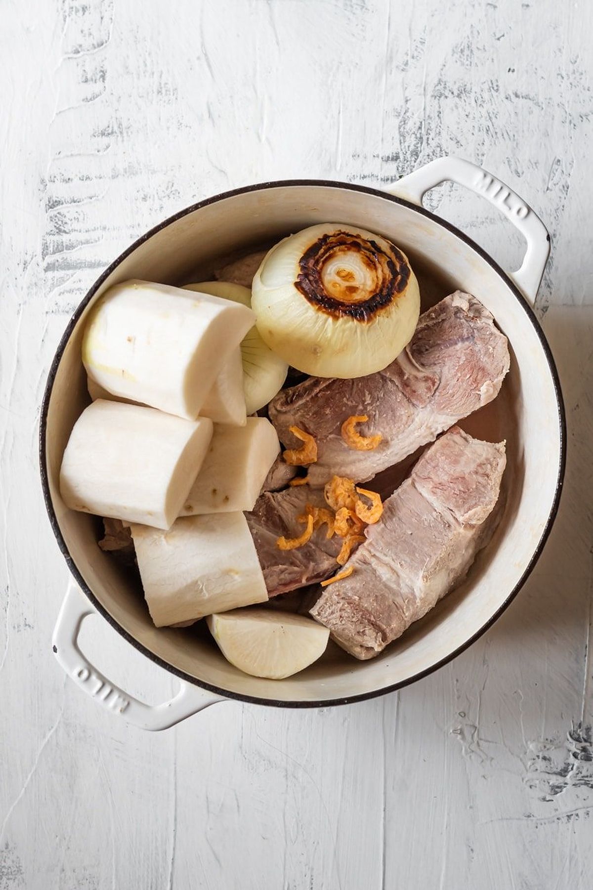 Preparation of broth ingredients for Banh Canh Tom Cua