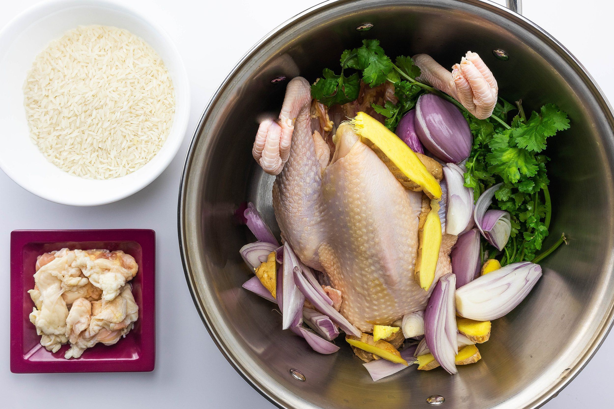 Rice, chicken fat, and aromatics for broth preparation