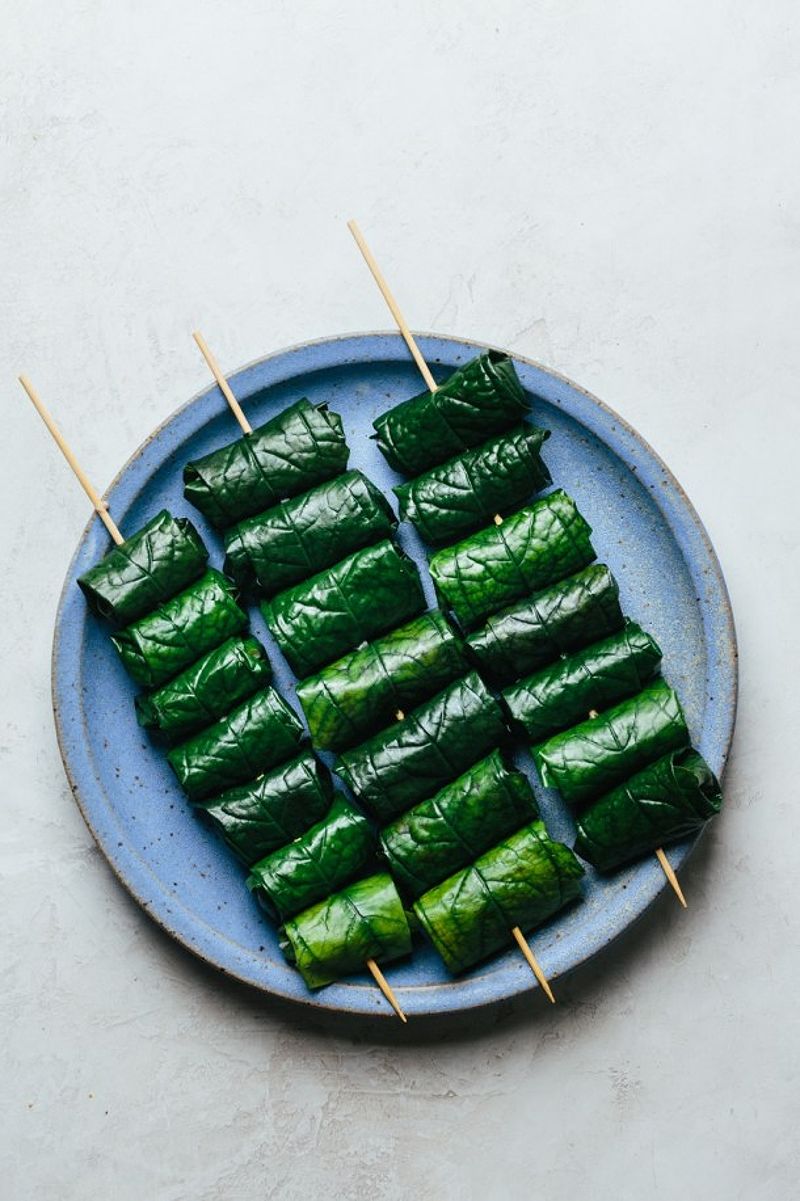 Skewers of grilled beef wrapped in betel leaves