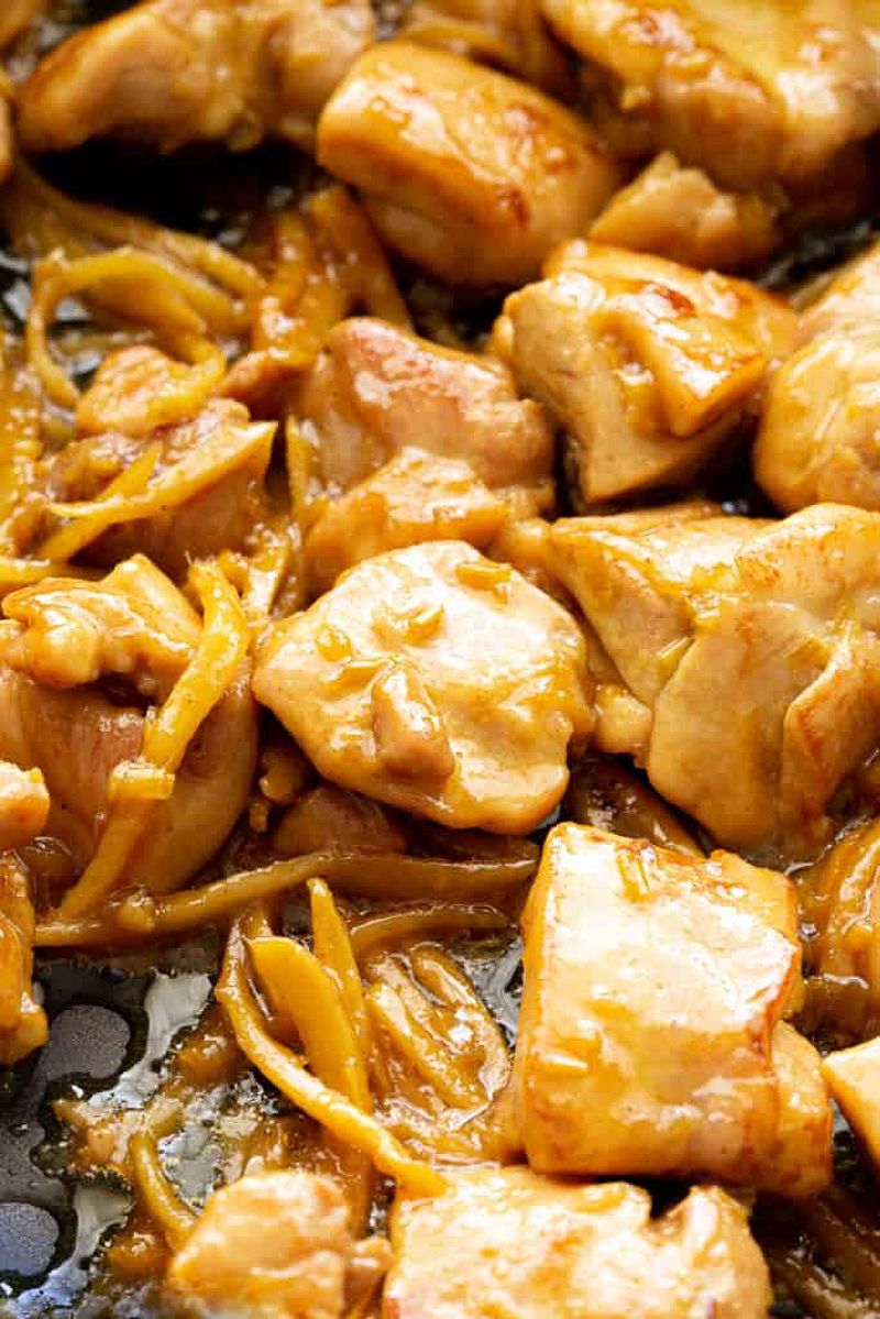 Vietnamese ginger chicken pieces stir frying in a large pan