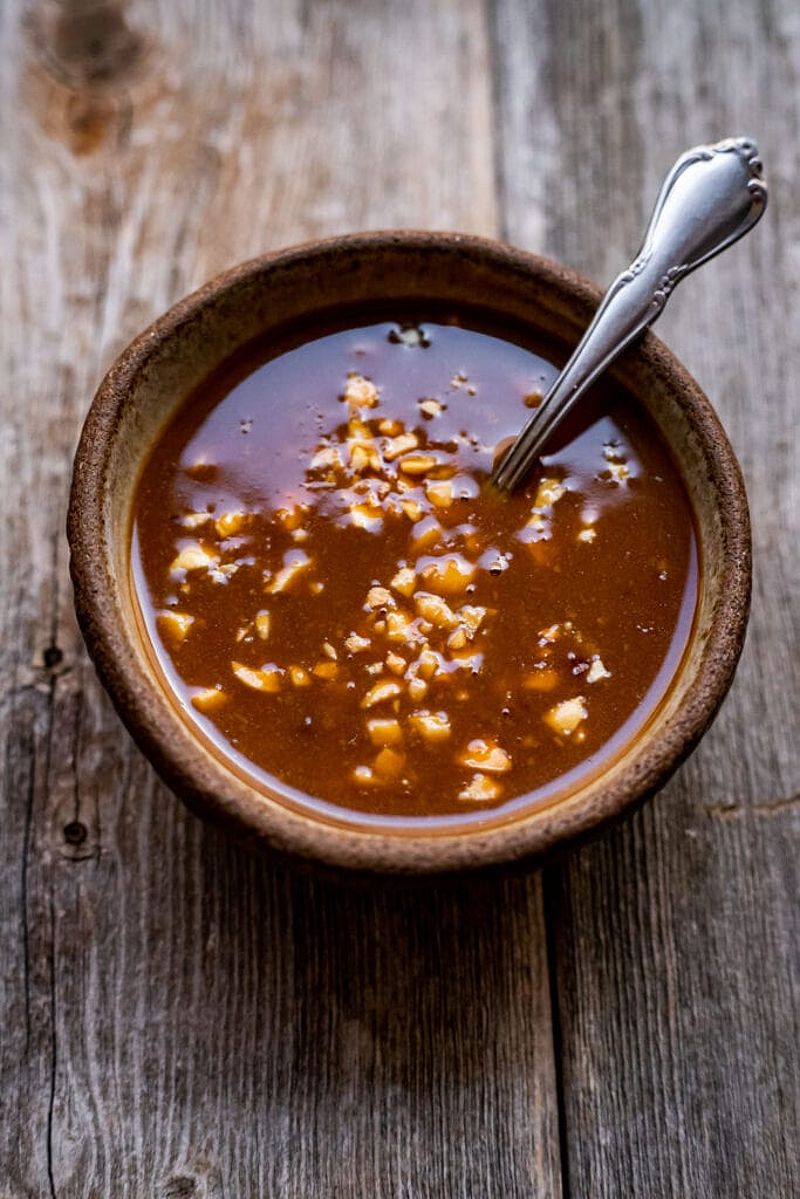 Vietnamese peanut sauce in a small bowl with a spoon